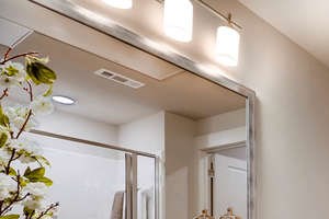 Spacious Bathroom with Granite Counter Tops & Walk-in Closet